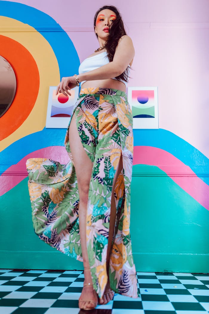 Colorful portrait featuring bold fashion and artistic background elements.